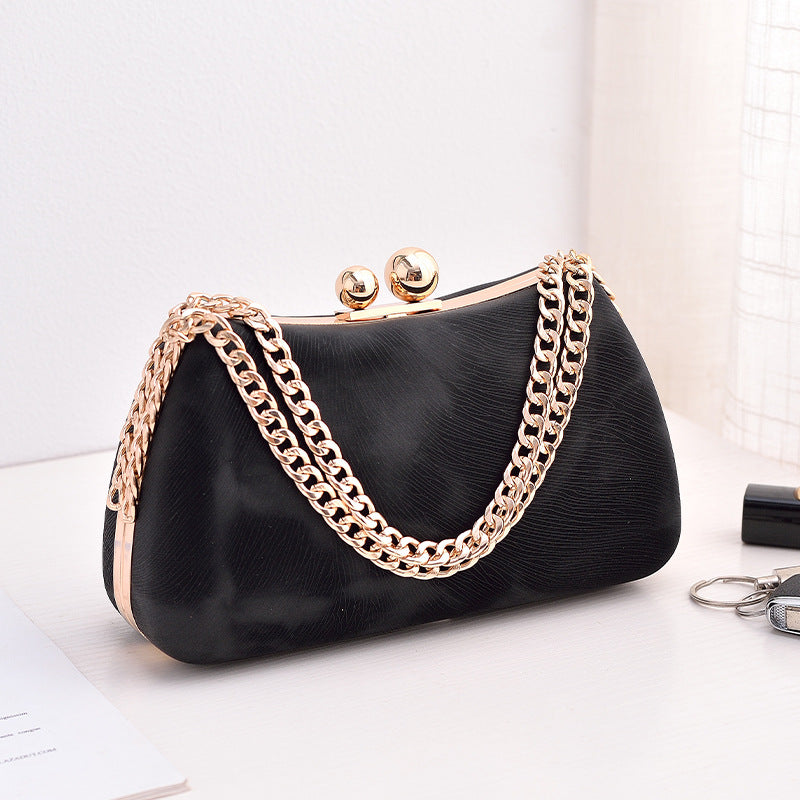 Maison Maryim Structured Pillow Evening Bag — side view — evening bag